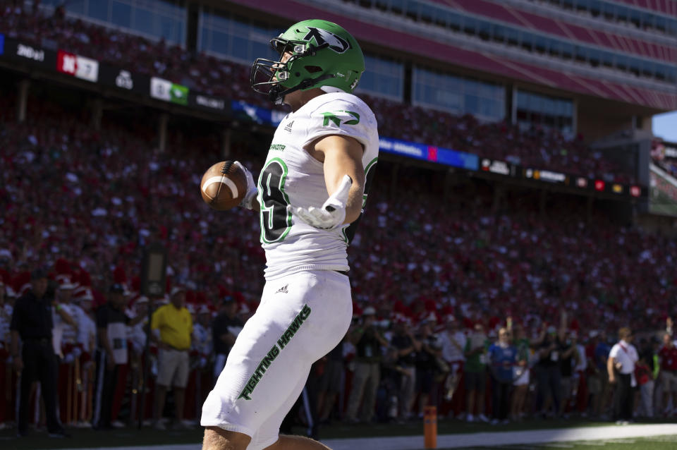 North Dakota's Adam Zavalney runs in a touchdown against Nebraska during the first half of an NCAA college football game Saturday, Sept. 3, 2022, in Lincoln, Neb. (AP Photo/Rebecca S. Gratz)