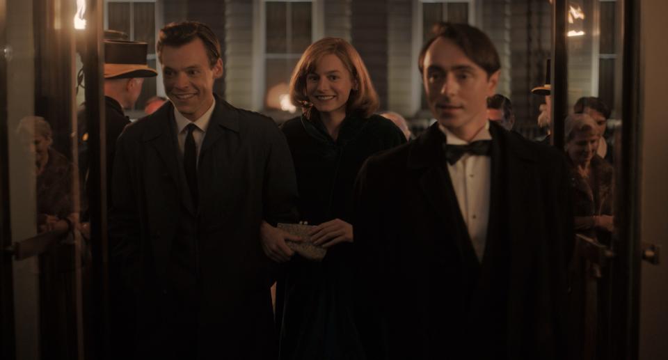 Harry Styles, left, as Tom, Emma Corrin as Marion and David Dawson as Patrick in "My Policeman."