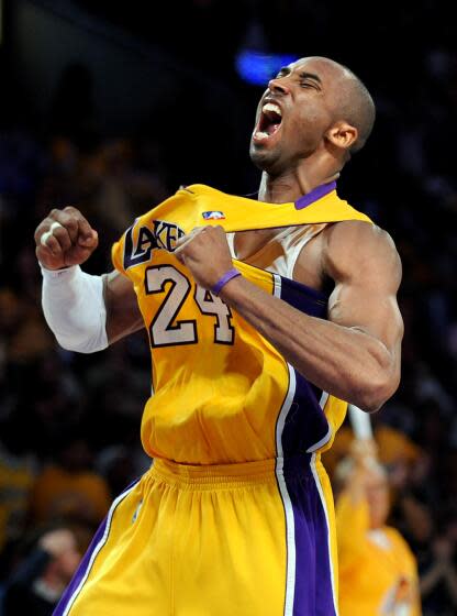 Lakers Kobe Bryant celebrates his three–pointer against the Nuggets