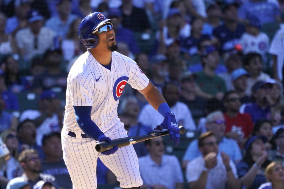 Chicago Cubs' Rafael Ortega watches his sacrifice fly scoring P.J. Higgins during the seventh inning of a baseball game against the Washington Nationals Wednesday, Aug. 10, 2022, in Chicago. (AP Photo/Charles Rex Arbogast)