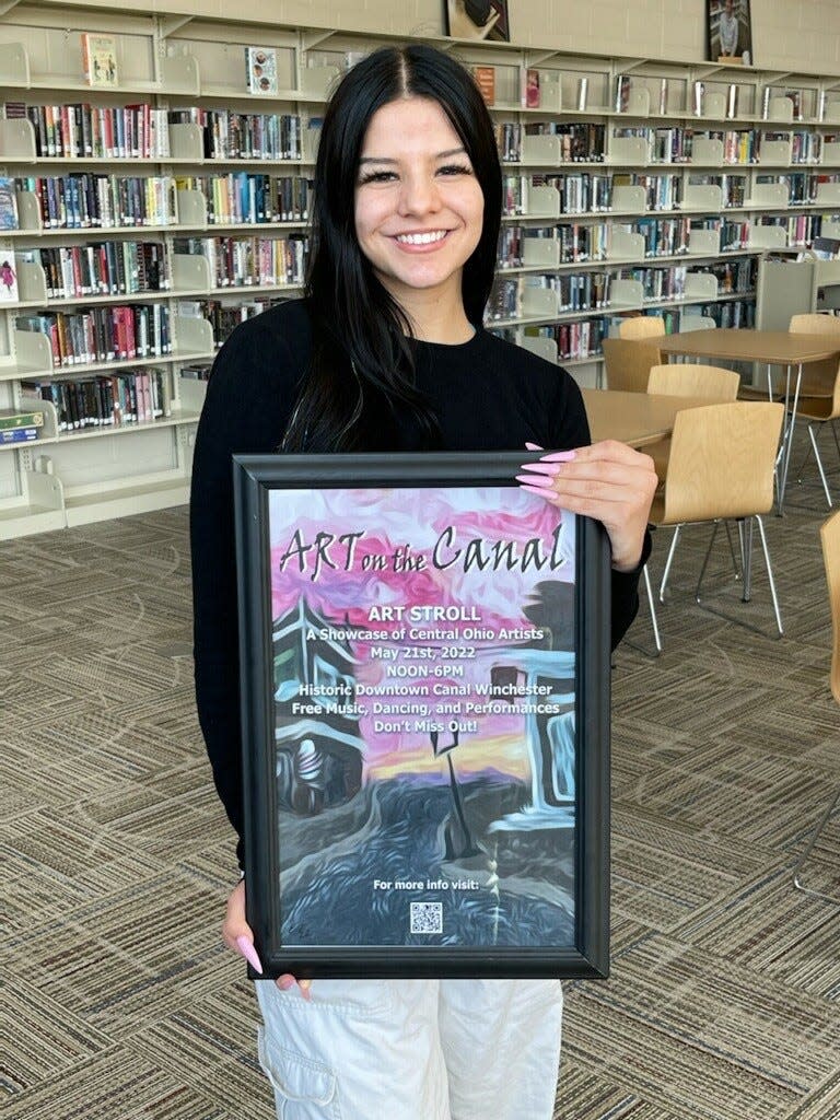 Canal Winchester High School senior Ellie Thompson holds the poster she designed for this year’s Art on the Canal Art Stroll. Nine students entered the Destination: Canal Winchester contest to design the event poster. Thompson was awarded $500.