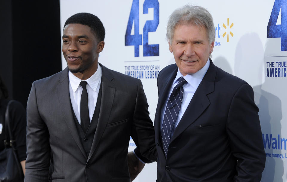 Chadwick Boseman, left, who plays Jackie Robinson in "42," poses with fellow cast member Harrison Ford at the Los Angeles premiere of "42" at the TCL Chinese Theater on Tuesday, April 9, 2013 in Los Angeles. (Photo by Chris Pizzello/Invision/AP)