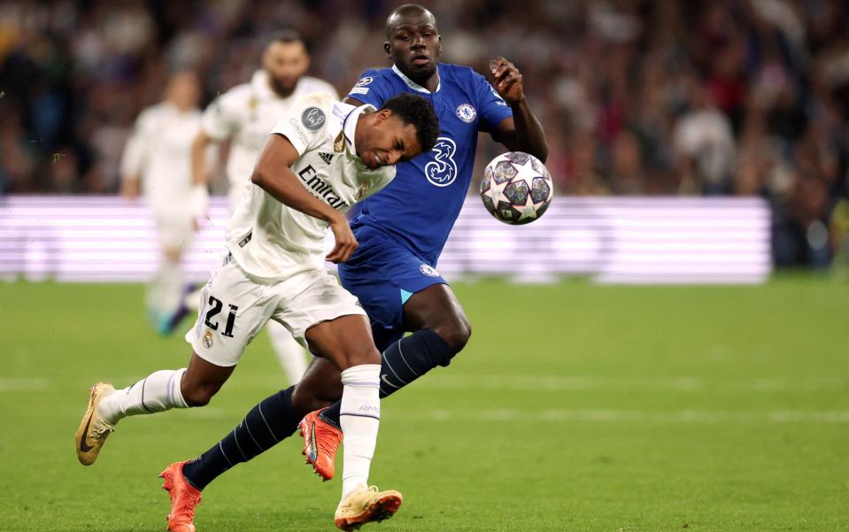 Real Madrid's Brazilian forward Rodrygo (L) vies with Chelsea's Senegalese defender Kalidou Koulibaly during the UEFA Champions League quarter final first leg football match between Real Madrid CF and Chelsea FC at the Santiago Bernabeu stadium in Madrid - Getty Images/Pierre-Philippe Marcou