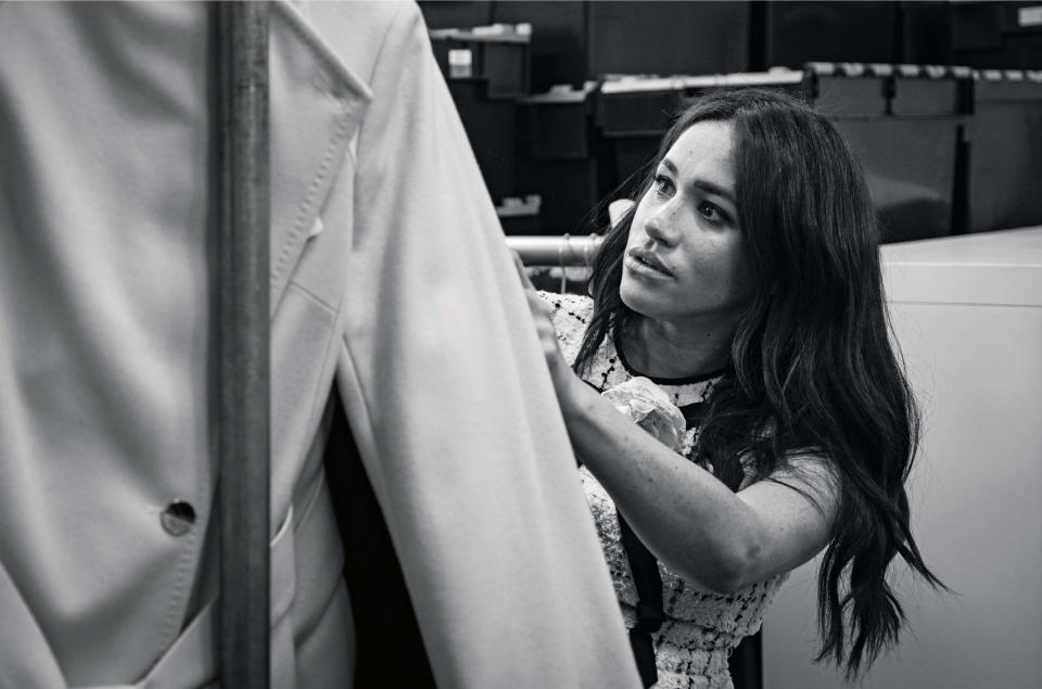 This undated handout photo issued on July 28, 2019 by Kensington Palace shows Britain's Meghan, Duchess of Sussex, Patron of Smart Works, in the workroom of the Smart Works London office. - Prince Harry's wife Meghan will guest edit the September issue of iconic fashion magazine British Vogue, which will see her in "candid conversation" with former first lady Michelle Obama. (Photo by @SussexRoyal / various sources / AFP) / XGTY / RESTRICTED TO EDITORIAL USE - MANDATORY CREDIT "AFP PHOTO / @SUSSEXROYAL" - NO MARKETING NO ADVERTISING CAMPAIGNS - NO COMMERCIAL USE - NO THIRD PARTY SALES - RESTRICTED TO SUBSCRIPTION USE - NO CROPPING OR MODIFICATION - DISTRIBUTED AS A SERVICE TO CLIENTS /         (Photo credit should read @SUSSEXROYAL/AFP via Getty Images)