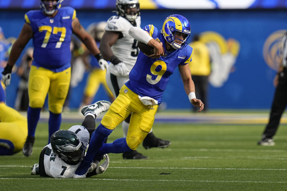 Los Angeles Rams quarterback Matthew Stafford, right, is tackled by Philadelphia Eagles linebacker Haason Reddick during the second half of an NFL football game Sunday, Oct. 8, 2023, in Inglewood, Calif. (AP Photo/Gregory Bull)