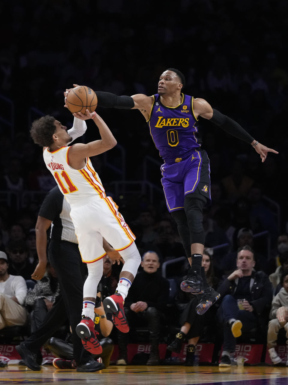 Atlanta Hawks' Trae Young (11) has his shot blocked by Los Angeles Lakers' Russell Westbrook (0) during the first half of an NBA basketball game Friday, Jan. 6, 2023, in Los Angeles. (AP Photo/Jae C. Hong)