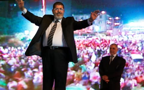 In this May 20, 2012 file photo Morsi, at that stage the Muslim Brotherhood's presidential candidate holds a rally in Cairo - Credit: &nbsp;Fredrik Persson/&nbsp;AP