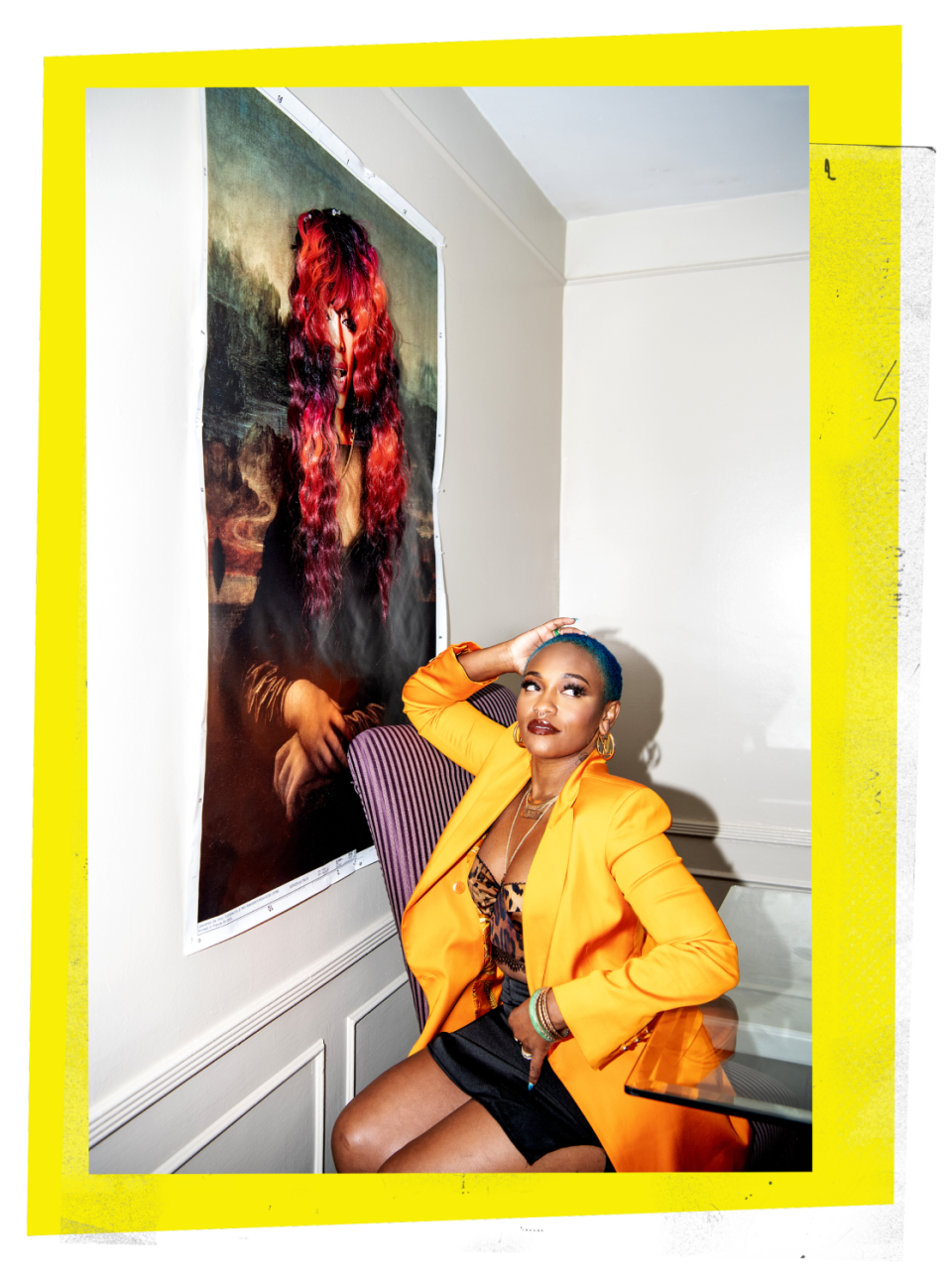 Portrait of celebrity hairstylist Shelby Swain posing in front of the artwork "Mona Trina"