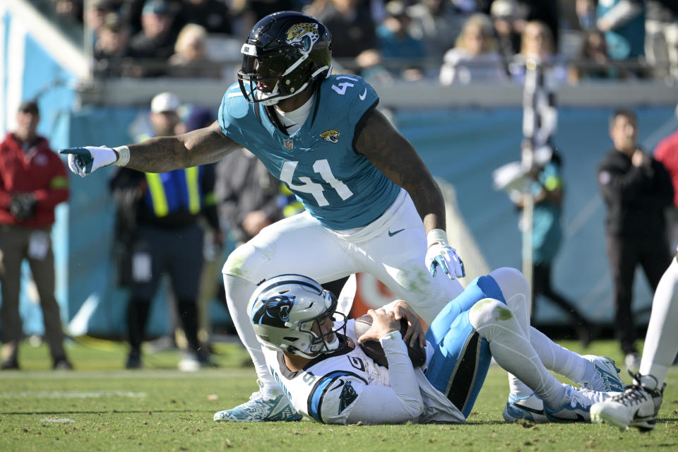 Jacksonville Jaguars linebacker Josh Allen celebrates after sacking Carolina Panthers quarterback Bryce Young during the first half of an NFL football game Sunday, Dec. 31, 2023, in Jacksonville, Fla. (AP Photo/Phelan M. Ebenhack)