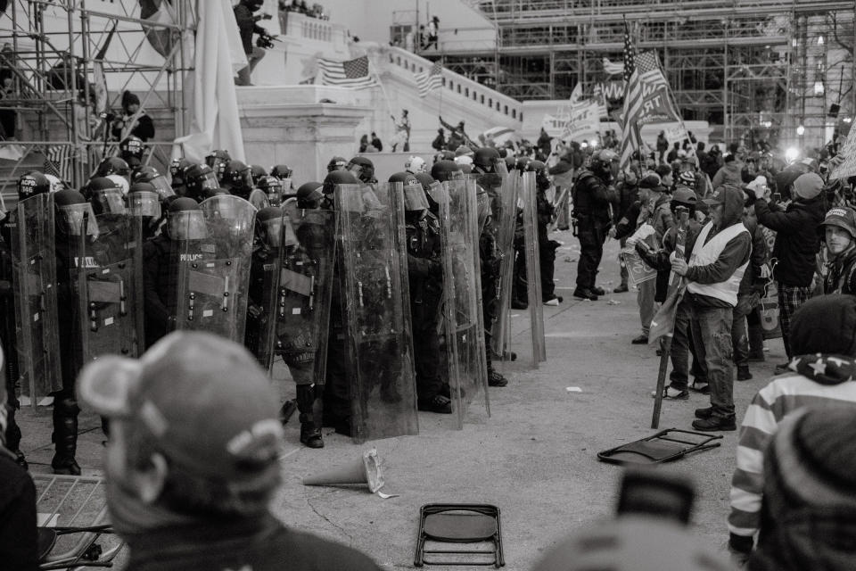 Pro-Trump rioters and police are seen outside of the Capitol in Washington.<span class="copyright">Christopher Lee for TIME</span>