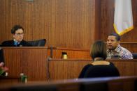 Judge Susan Garsh (L) watches as prosecution witness Alexander Bradley is questioned by the prosecution without the jury present at the trial of former New England Patriots football player Aaron Hernandez (not pictured) at Bristol County Superior Court in Fall River, Massachusetts April 1, 2015. Hernandez, 25, had a $41 million contract with the National Football League team but was dropped hours after his arrest in June, 2013 on murder and firearms charges in the death of Lloyd, who had been dating his fiancée's sister. Hernandez, who has pleaded not guilty, faces life in prison if convicted. REUTERS/Brian Snyder