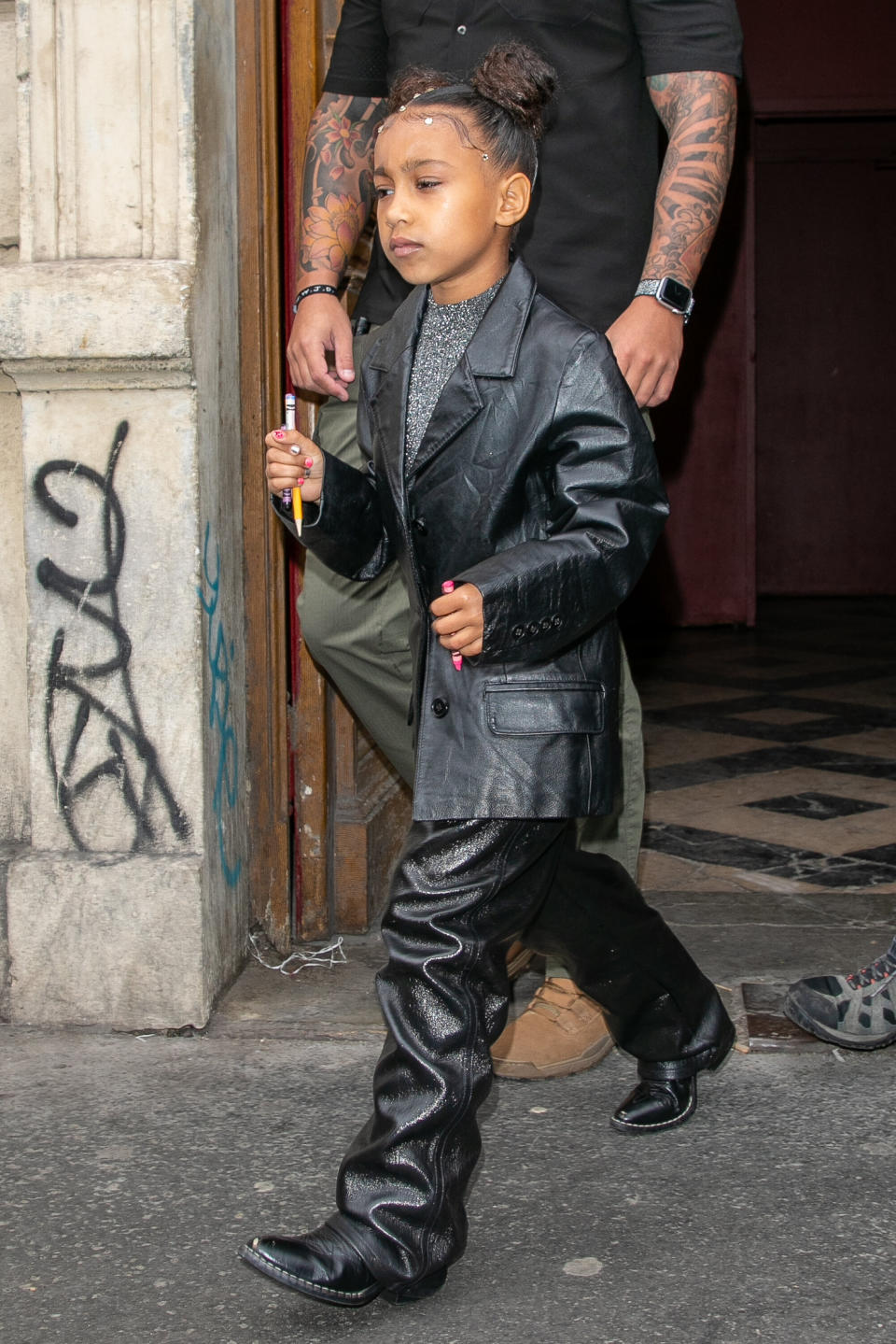 North West leaves Kanye West's Sunday Service during Paris Fashion Week on March 1.&nbsp;