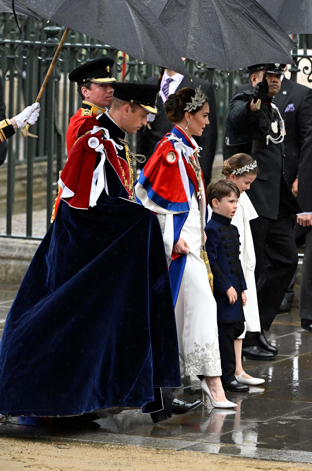 Princess Charlotte matched with her mother, the Princess of Wales, in an ivory Alexander McQueen dress and silver floral headpiece. (Getty Images)