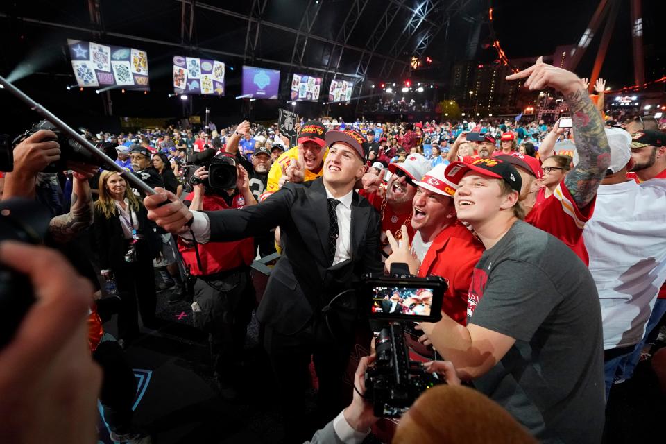 Purdue defensive end George Karlaftis celebrates with fans after he was chosen by the Kansas City Chiefs with the 30th pick at the 2022 NFL Draft, Thursday, April 28, 2022, in Las Vegas. (AP Photo/Steve Luciano)