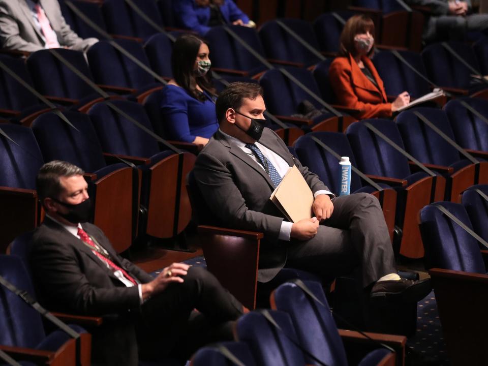 Santos at 2020 new member orientation, seated near Republican Rep. Ronny Jackson of Texas and Democratic Rep. Sara Jacobs of California.