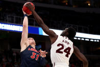 <p>Abdul Ado #24 of the Mississippi State Bulldogs blocks a shot by Scottie James #31 of the Liberty Flames during their game in the First Round of the NCAA Basketball Tournament at SAP Center on March 22, 2019 in San Jose, California. (Photo by Yong Teck Lim/Getty Images) </p>
