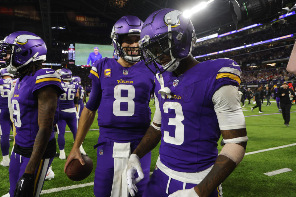 Minnesota Vikings quarterback Kirk Cousins (8) celebrates with teammate wide receiver Jordan Addison (3) after an NFL football game against the San Francisco 49ers, Monday, Oct. 23, 2023, in Minneapolis. The Vikings won 22-17. (AP Photo/Bruce Kluckhohn)