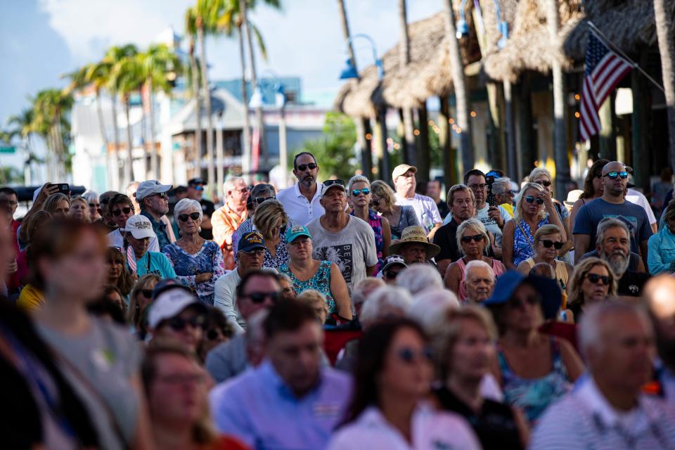 People attend the 1 year anniversary of Hurricane Ian on Fort Myers Beach on Thursday, Sept. 28, 2023.