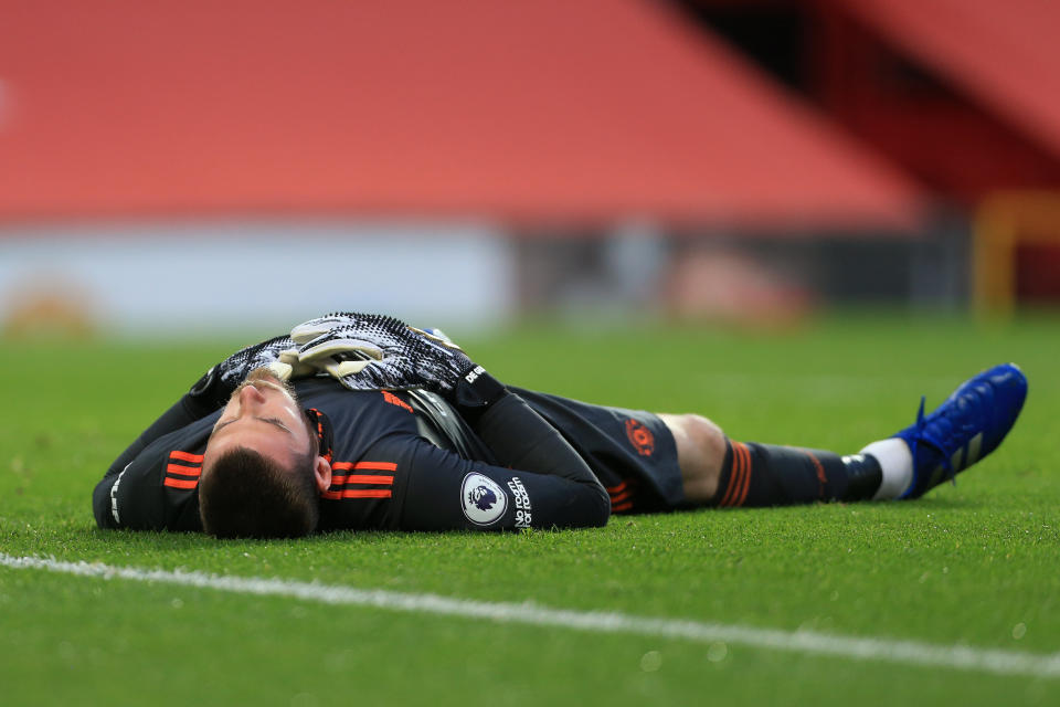 MANCHESTER, ENGLAND - OCTOBER 04: Man Utd goalkeeper David de Gea lies on the floor exhausted during the Premier League match between Manchester United and Tottenham Hotspur at Old Trafford on October 4, 2020 in Manchester, United Kingdom. Sporting stadiums around the UK remain under strict restrictions due to the Coronavirus Pandemic as Government social distancing laws prohibit fans inside venues resulting in games being played behind closed doors. (Photo by Simon Stacpoole/Offside/Offside via Getty Images)
