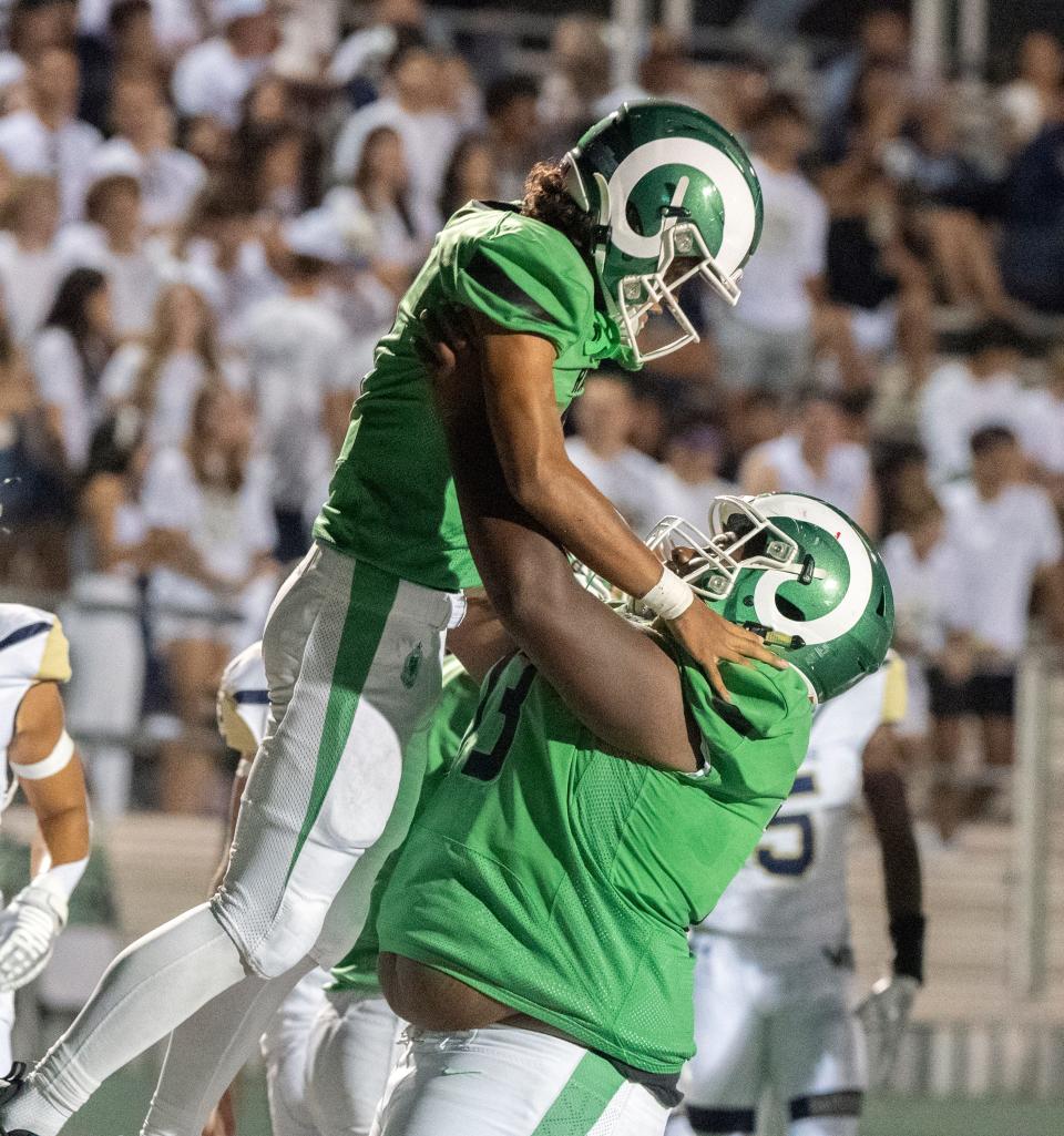 St. Mary's Samson Hunkin, left, celebrates with teammate Xavier Johnson after scoring touchdown during the so-called "Holy Bowl" varsity football game against Central Catholic at St. Mary's Sanguinetti Field in Stockton on Aug. 25, 2023.