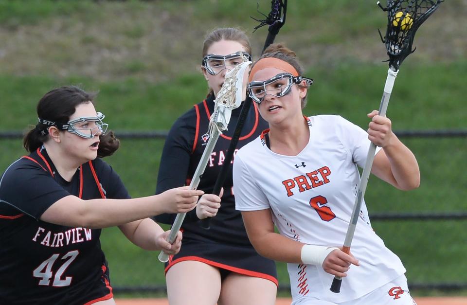 Fairview High School's Isabella Dorfmeister, left, defends Cathedral Prep's Sophia Glance during a girls lacrosse game at Dollinger Field on Thursday. Glance scored three goals in the Ramblers' 14-8 win.