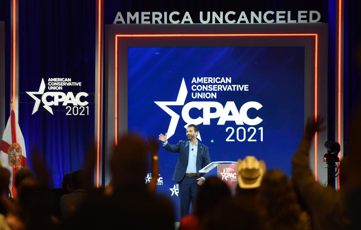 Donald Trump, Jr. waves as he leaves the stage after addressing attendees at the 2021 Conservative Political Action Conference. (Photo: Photo by Paul Hennessy/SOPA Images/LightRocket via Getty Images)