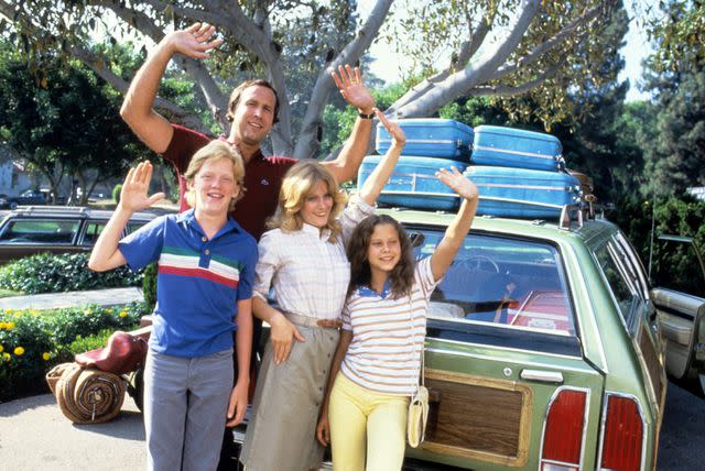 <p>Everett Collection</p> (L-R) Anthony Michael Hall, Chevy Chase, Beverly D'Angelo and Dana Barron in 'National Lampoon's Vacation' in 1983
