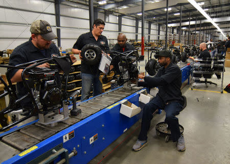 Workers construct mini-bikes at motorcycle and go-kart maker Monster Moto in Ruston, Louisiana January 25, 2017. Picture taken January 25, 2017. REUTERS/Nick Carey