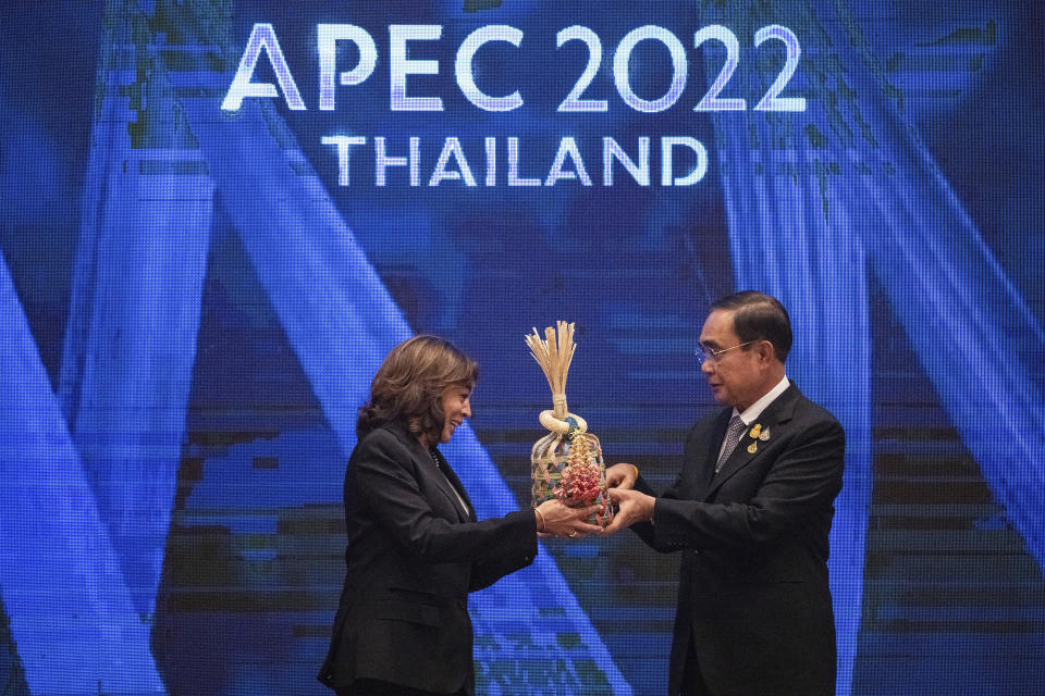 U.S. Vice President Kamala Harris, left, and Thailand's Prime Minister Prayuth Chan-ocha hold a Chalom, a bamboo basket symbolizing the "handing over of the baton", as the U.S. is the next summit host during the closing of the Asia-Pacific Economic Cooperation, APEC summit, Saturday, Nov. 19, 2022, in Bangkok, Thailand. (Haiyun Jiang/The New York Times via AP, Pool)