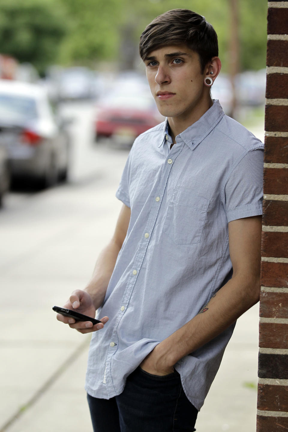 Dylan Young, 18, a senior at North Arlington High, stands Wednesday, June 6, 2012, near the site where he was in a fender bender caused by being distracted while texting and driving, in North Arlington, N.J. More than half of high school seniors say they text or email while driving, according to a jarring new study that offers the first federal statistics on how common the dangerous habit is in teens. The Centers for Disease Control and Prevention released the numbers Thursday, June 7, 2012. They come from a 2011 survey of about 15,000 high school students across the country. The study found 58 percent of high school seniors said that, in the previous month, they had texted or emailed while driving. (AP Photo/Julio Cortez)