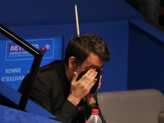 Ronnie O'Sullivan must overturn a 5-4 deficit to avoid a first-round elimination at the World Snooker Championship (PA)