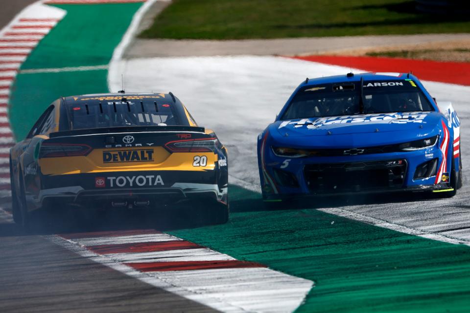 Kyle Larson (right), spins after an on-track incident that Christopher Bell (20), avoids during the NASCAR Cup Series EchoPark Automotive Grand Prix at Circuit of The Americas on March 26, 2023 in Austin, Texas.