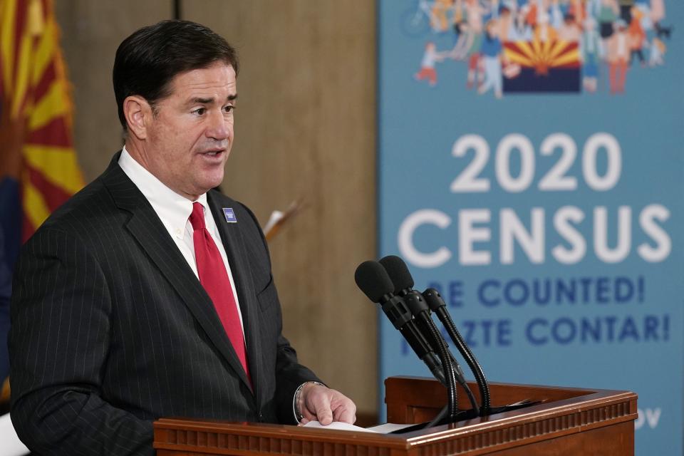 Arizona Gov. Doug Ducey speaks at a news conference with U.S. Census Director Steven Dillingham and other state leaders to urge Arizonans to participate in the nation's once-a-decade census population count Thursday, Sept. 17, 2020, in Phoenix. Ending the 2020 census at the end of September instead of the end of October, could cost Florida and Montana congressional seats and result in Texas, Florida, Arizona, Georgia, and North Carolina losing $500 million in federal funding for healthcare for its neediest residents. (AP Photo/Ross D. Franklin, Pool)