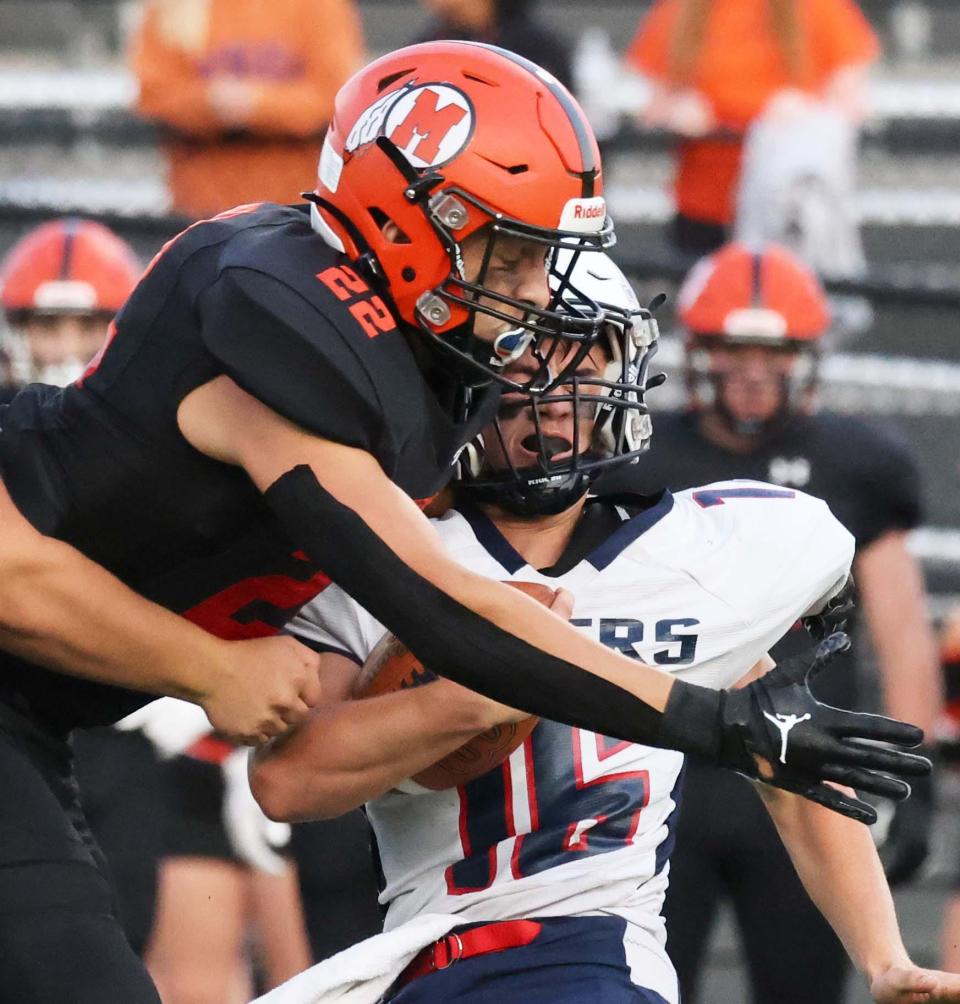 Middleboro's Mekhi Landahl tackles Apponequet's Harrison Lemieux on special teams during a game on Friday, Sept. 9, 2022. 