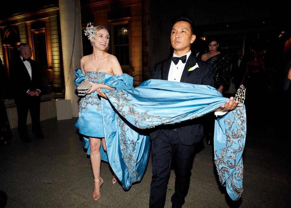 Diane Kruger is escorted by Prabal Gurung into the 2018 Met gala.