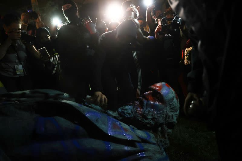 Protesters topple a statue of Albert Pike amid demonstrations and events on Juneteenth, which commemorates the end of slavery in Texas, in Washington