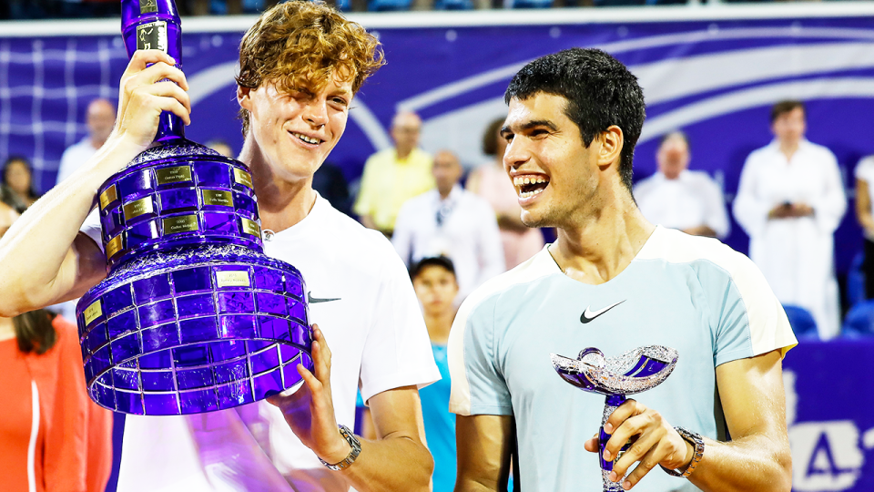 Jannik Sinner (pictured left) and rival Carlos Alcaraz (pictured right) share a laugh during the Umag trophy celebration.