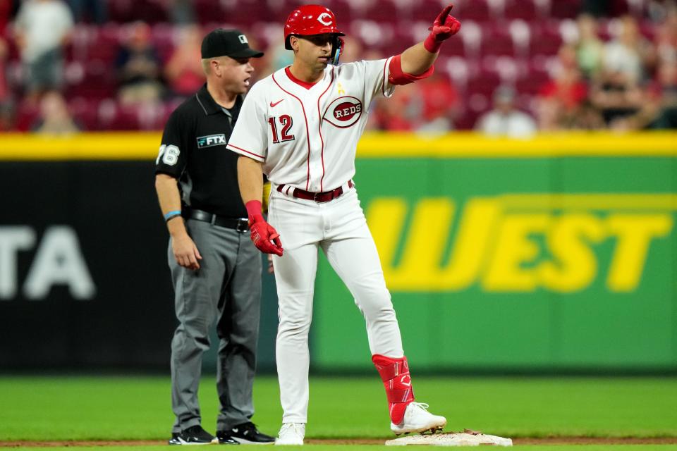 Cincinnati Reds third baseman Spencer Steer (12) gestures toward the dugout after hitting a double during the ninth inning of a baseball game against the Colorado Rockies, Friday, Sept. 2, 2022, at Great American Ball Park in Cincinnati. 