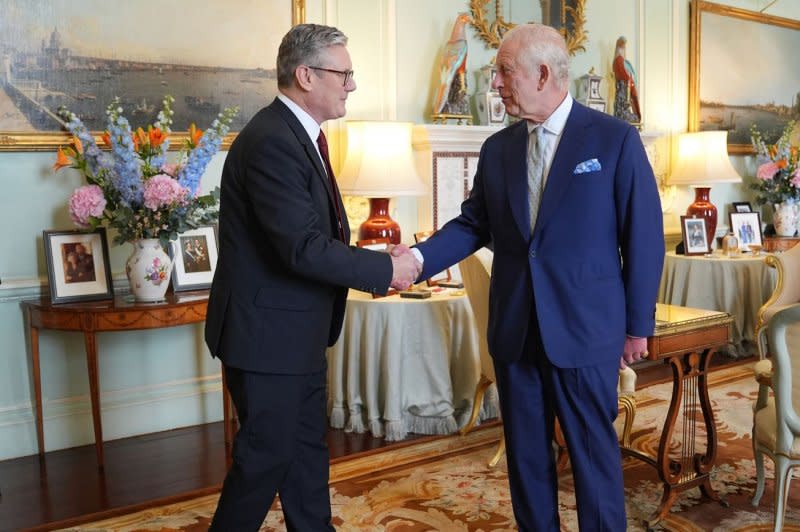 King Charles III receives Keir Starmer inside Buckingham Palace on Friday for a so-called "kissing the hands" ceremony, requesting him to form a new administration of the United Kingdom. Stamer accepted and was appointed prime minister and first lord of the treasury. Photo via The Royal Family/UPI