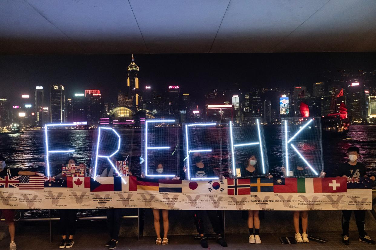 Pro-democracy protesters hold up a ‘Free HK’ LED sign during a demonstration on 30 September, 2019 in Hong Kong, China. (Getty Images)