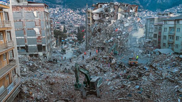 PHOTO: This aerial photograph taken on Feb. 20, 2023 shows diggers removing the rubble of collapsed buildings in Antakya, southern Turkey. (Sameer Al-DOUMY/AFP via Getty Images)