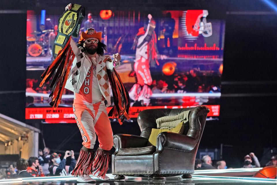 Cleveland Browns fan "Macho Man" dances on stage as the Browns are on the clock in the second round of the NFL football draft, Friday, April 30, 2021, in Cleveland.