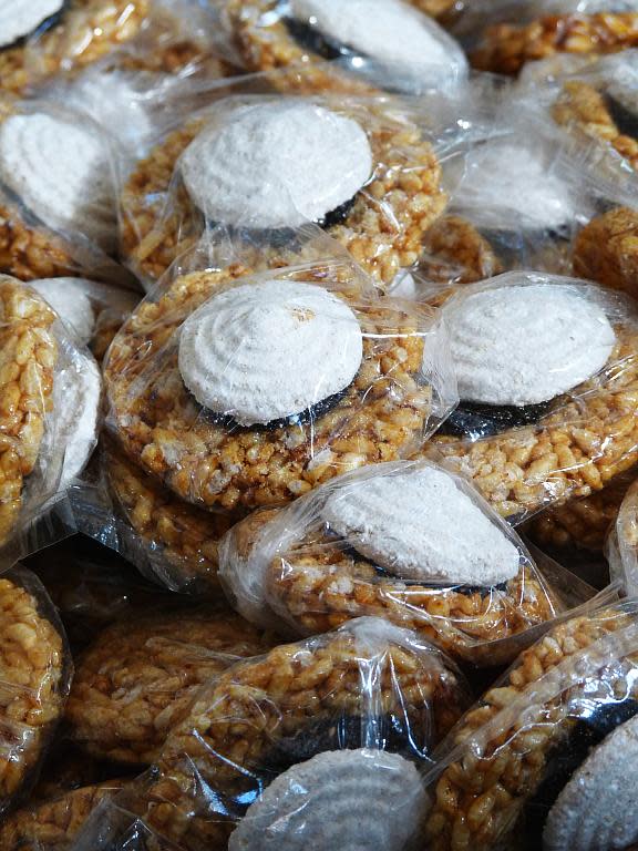 Puffed-rice and jaggery sweets similar to chikkis, with a disc of candied sugar atop, look very inviting.