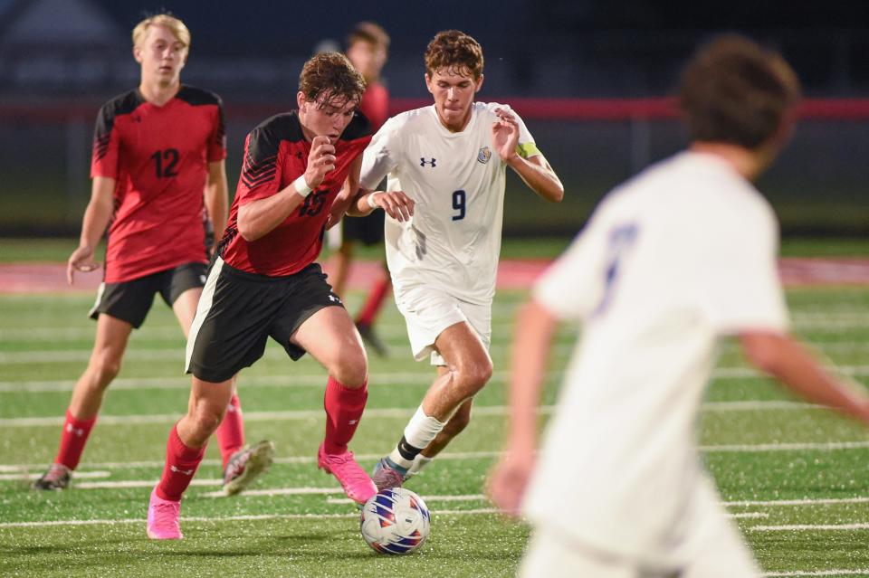 River Valley's Gabe Douce (9) runs along with a Crestview soccer player during a match earlier this season. Douce was named Fahey Bank Athlete of the Month for October among Marion County boys.