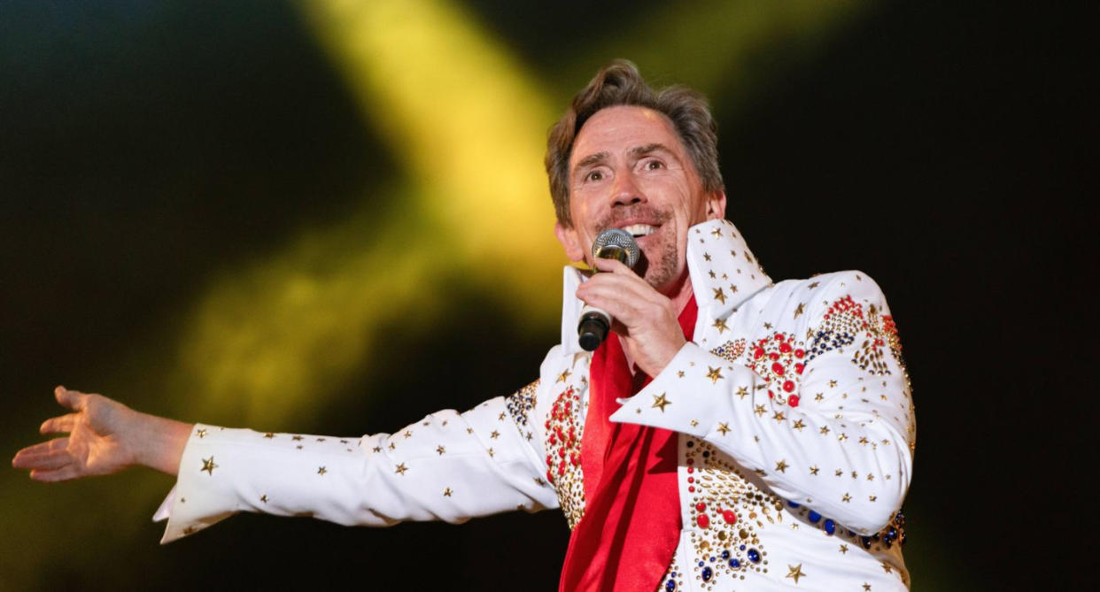 Rob Brydon performed on the main stage at charity fundraiser Car Fest South dressed as an Elvis impersonator, August, 2022. (Getty Images)