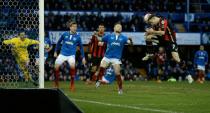 Bournemouth's midfielder Marc Pugh (R) heads the ball to score his team's second goal during the English FA Cup fourth round match against Portsmouth on January 30, 2016