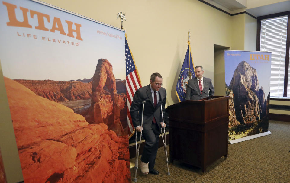 Sen. Dan McCay, R - Riverton, right, looks on as Bob Steiner, left, Co-CEO of Alsco Inc., walks off during a news conference Thursday, Jan. 24, 2019, in Salt Lake City. Alsco, a Utah company is donating $100,000 to keep three national parks open as the federal government shutdown drags on, a gift that state officials say is unique in the country. Salt Lake City-based uniform and linen rental company Alsco said Thursday, Jan, 24, 2019, the money will fund operations at Zion, Bryce and Arches national parks. It will pay for basic custodial and visitor center services at least through Feb 18, as the parks' busy season begins.(AP Photo/Rick Bowmer)