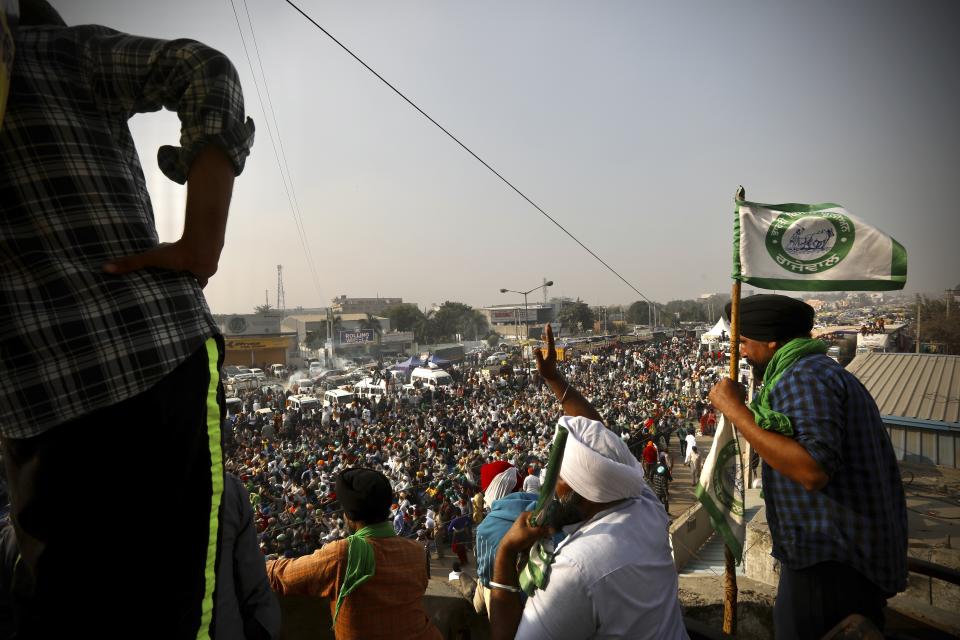 FILE - In this Thursday, Dec. 3, 2020, file photo, farmers raise slogans during a protest against new farm laws on a highway at the Delhi-Haryana state border, India. The protests against the Modi government are the biggest since he first came to power in 2014. They come at a time when the country’s economy has tanked, social strife has widened, protests have erupted against laws some deem discriminatory and the government has been questioned over its response to the coronavirus pandemic. (AP Photo/Manish Swarup, File)