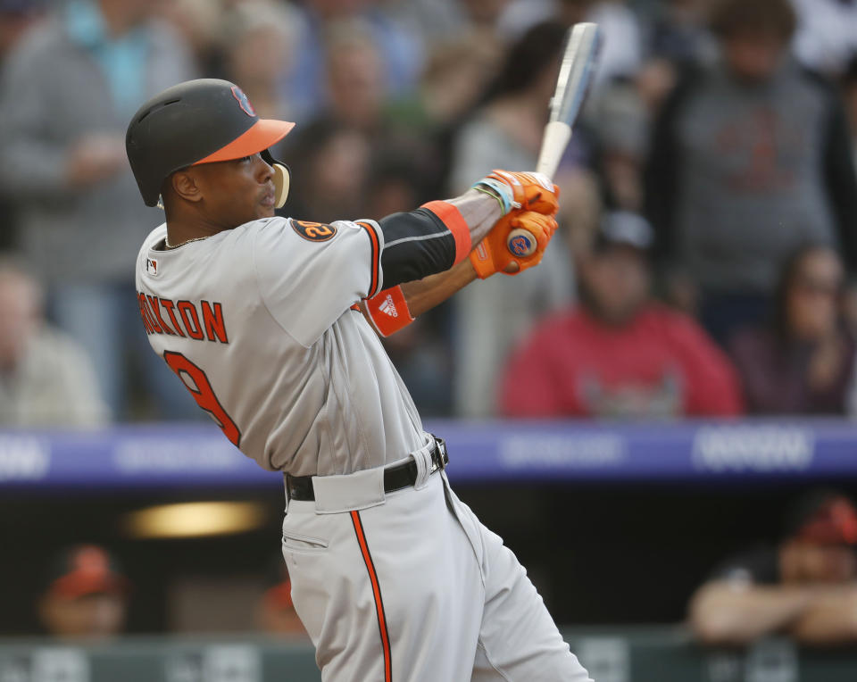 Baltimore Orioles' Keon Broxton swings at a pitch on the way to striking out against Colorado Rockies starter Jeff Hoffman in the third inning of a baseball game Friday, May 24, 2019, in Denver. (AP Photo/David Zalubowski)