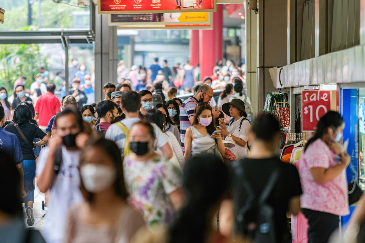 People are wearing face masks as a preventive measure against the spread of COVID-19 during the early days of the pandemic in Singapore. 